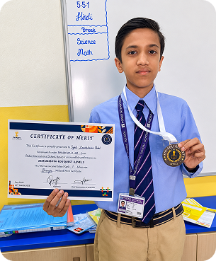 Student holding a financial literacy certificate